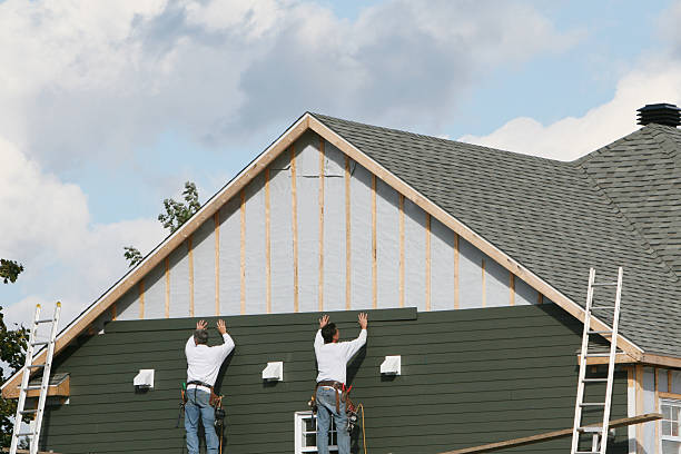 Professional Siding technician working in Westbury, NY
